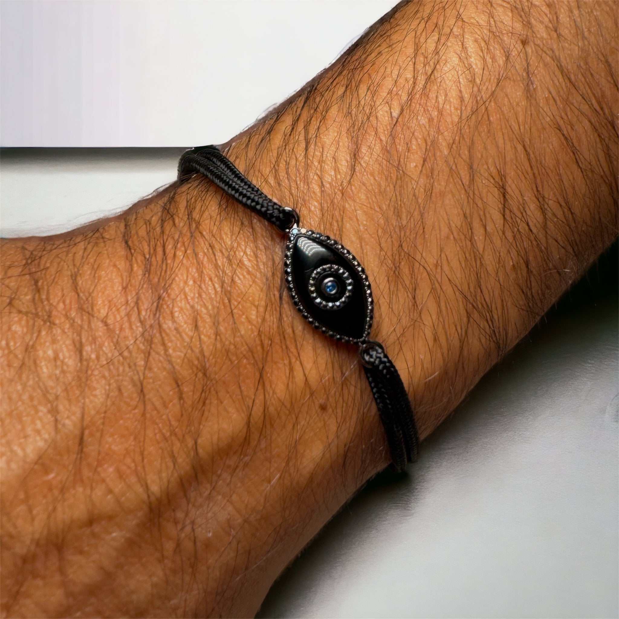 14K black gold Link Bracelet with Black Onyx evil eye and pavé black diamonds.