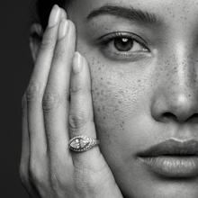 Load image into Gallery viewer, Woman wearing a Ring in 14K gold with a marquise white diamond and pavé white diamonds