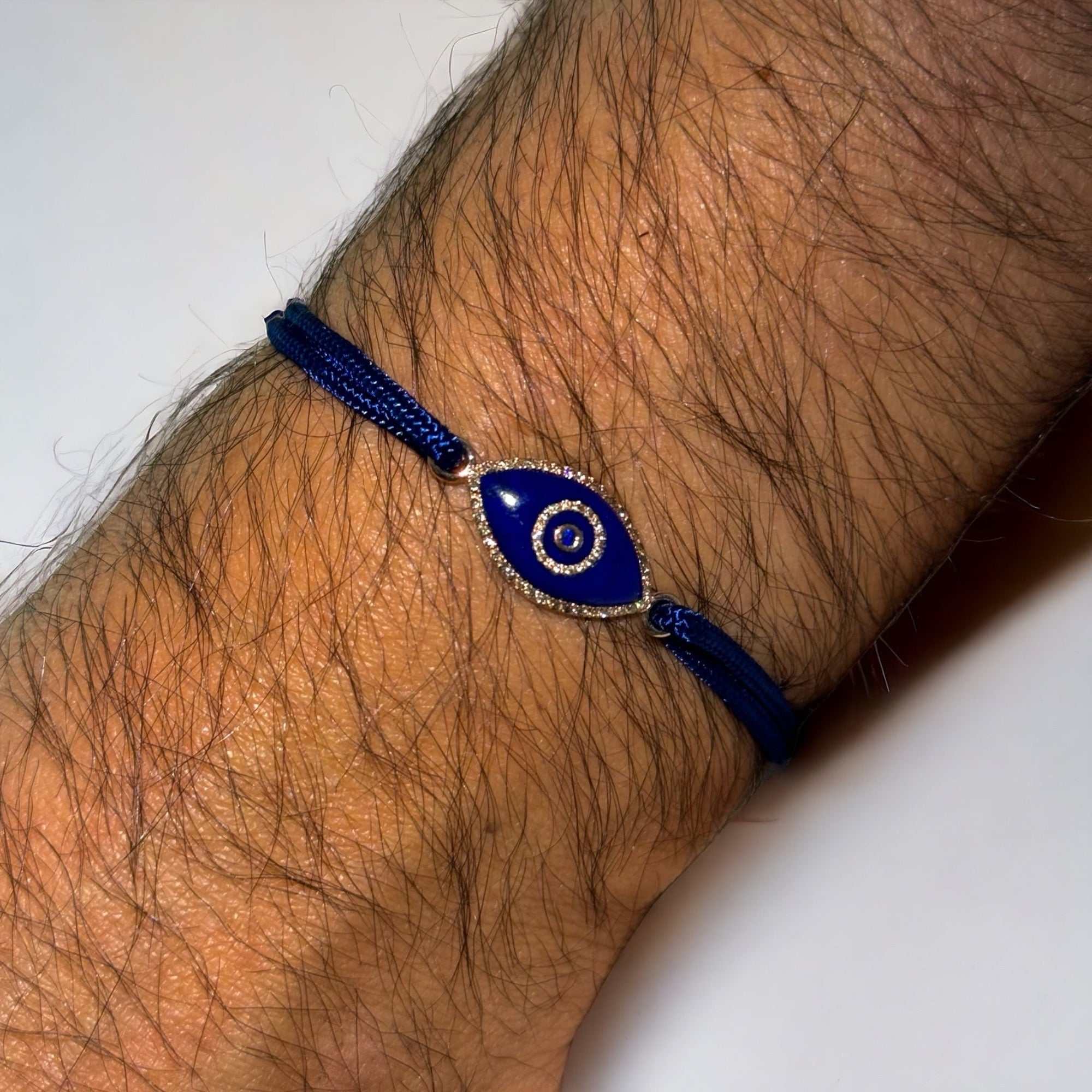 14K gold Link Bracelet with Lapis Lazuli evil eye, pavé diamonds, and sapphire