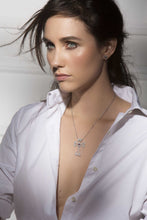 Load image into Gallery viewer, Close up 14K white gold Sacred Talisman Cross Divine with pavé white diamonds and ruby
